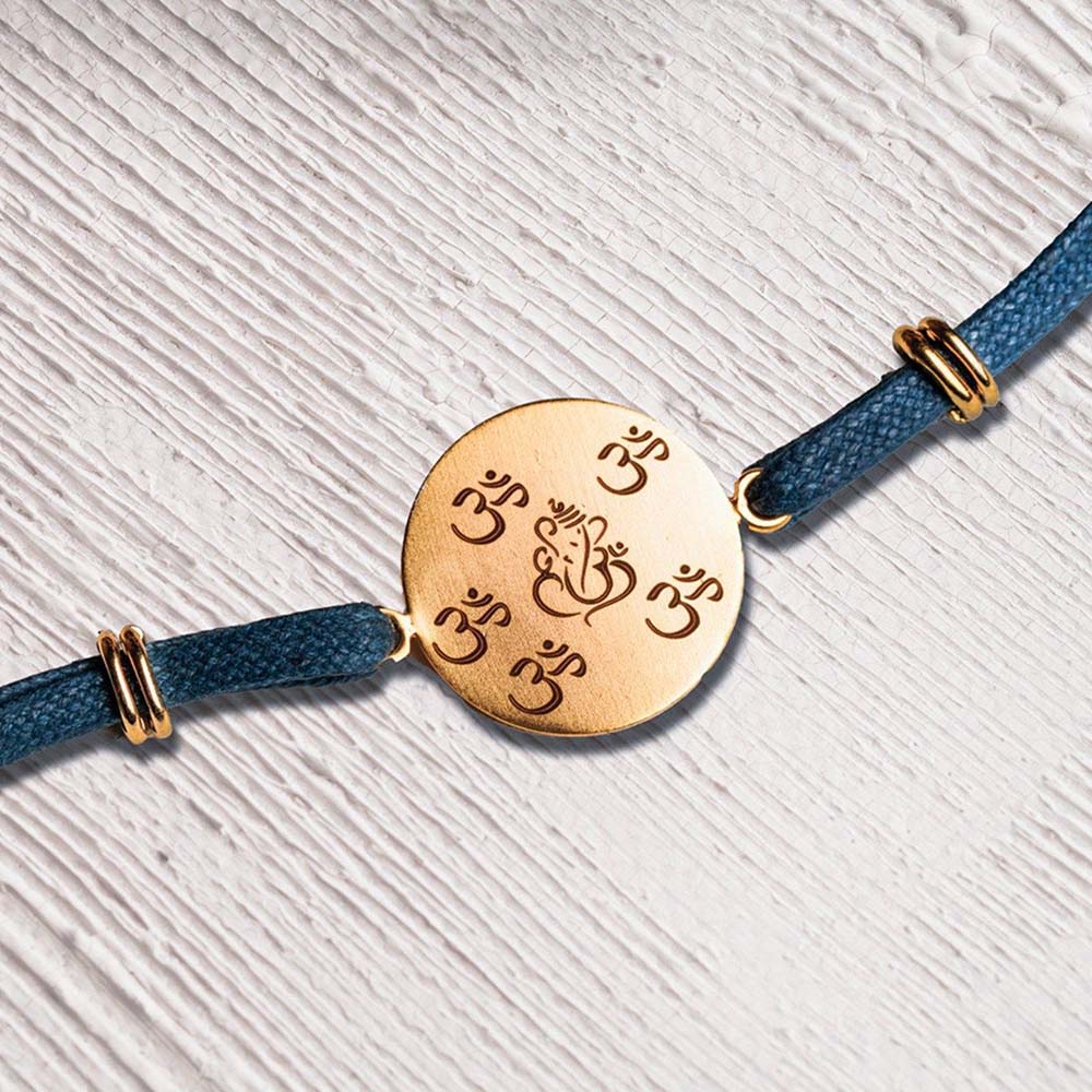 Suhani Pittie Laser Om & Ganeshji Rakhi Disc with Denim Thread (22k Gold Plated)