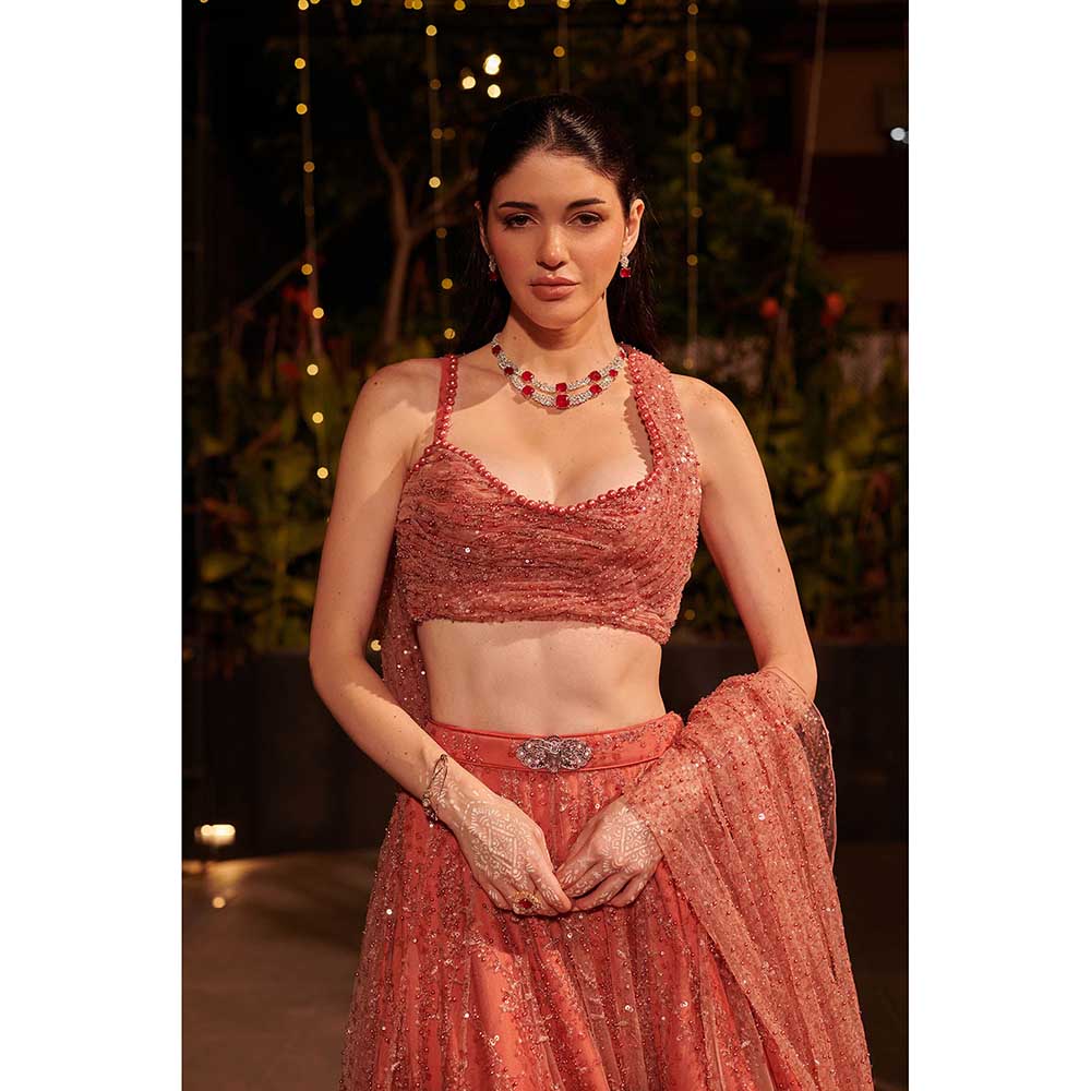 Jigar and Nikita Coral Rose Dust Drape Attached Blouse with Lehenga (Set of 2)