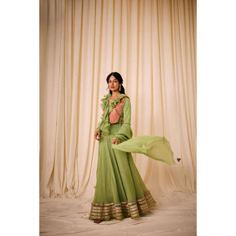 Leela by A Green Blouse With Ruffled Neck Along With Peach Bib And Fully Highlighted Lehenga