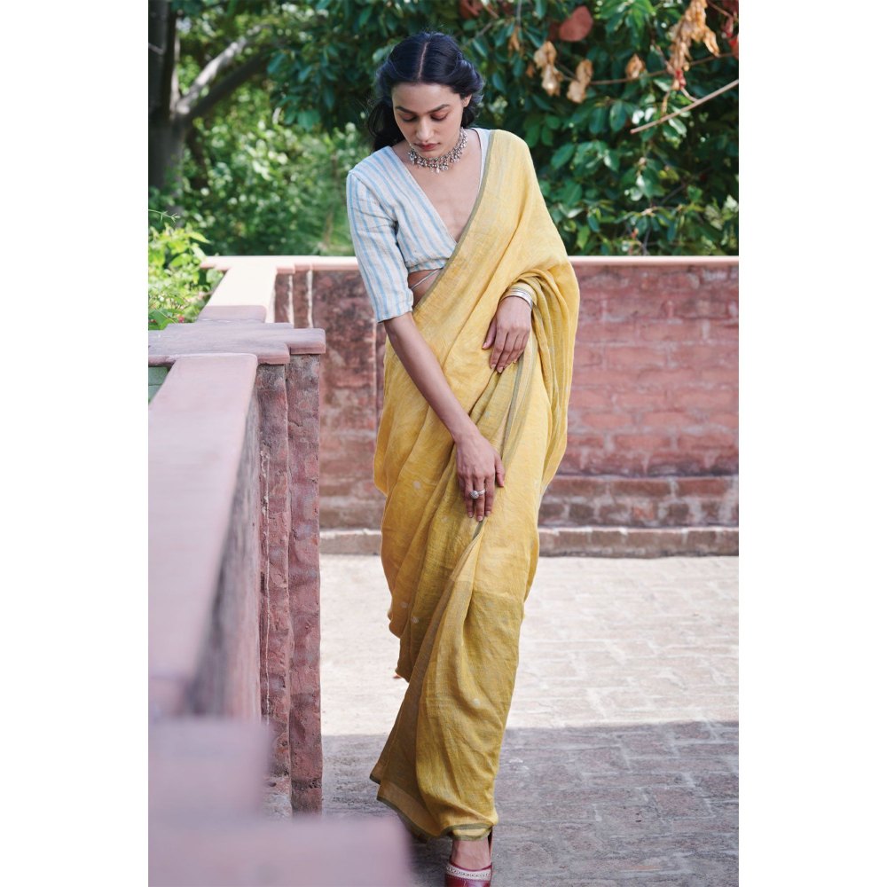 Dressfolk multi toned handwoven yellow saree with detailed jamdani work and silver zari buttas.
